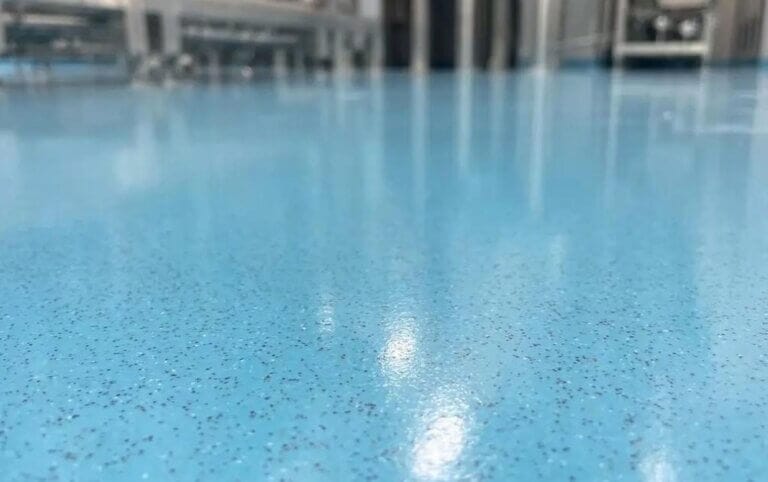 Epoxy colored sand floor in industrial workshop